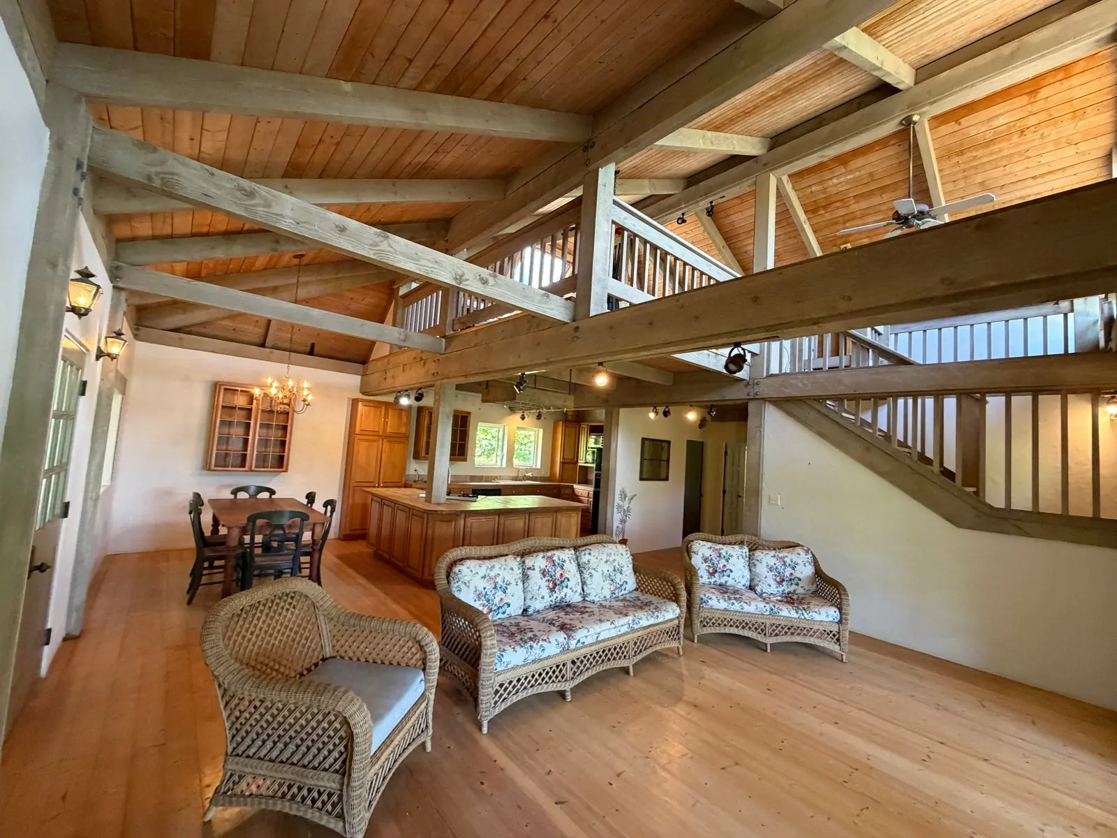 Great room with soaring open-beam wood ceilings